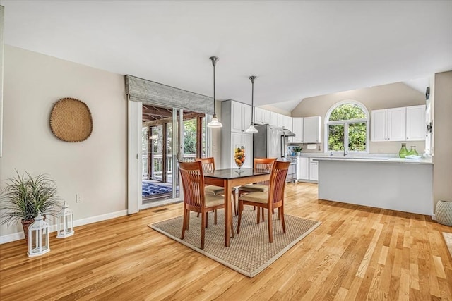 26 Sandy Meadow Way, Eastham, MA 02642 - dining room with light wood-type flooring and lofted ceiling