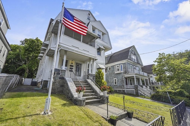 46 Converse Ave Unit 1, Malden, MA 02148 - view of front of home featuring covered porch, stairway, and a balcony