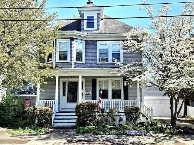 308 Hawthorn St, New Bedford, MA 02740 - view of front of house featuring a porch, a garage, an outbuilding, and cooling unit