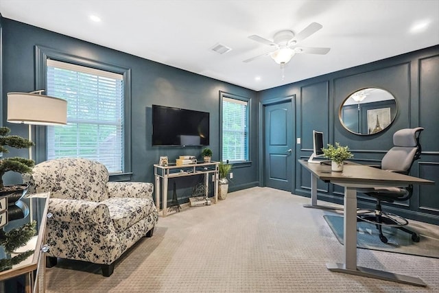 carpeted office with a decorative wall, ceiling fan, and recessed lighting
