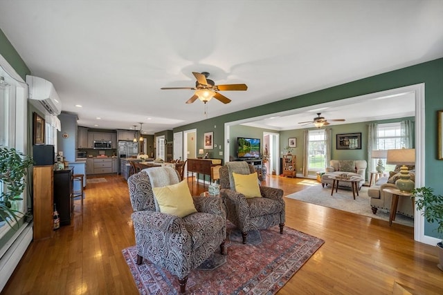 28 Sewall St, Shrewsbury, MA 01545 - living area featuring ceiling fan, wood finished floors, an AC wall unit, and recessed lighting