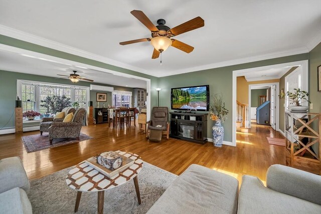 28 Sewall St, Shrewsbury, MA 01545 - living area featuring wood finished floors, a ceiling fan, crown molding, and baseboards
