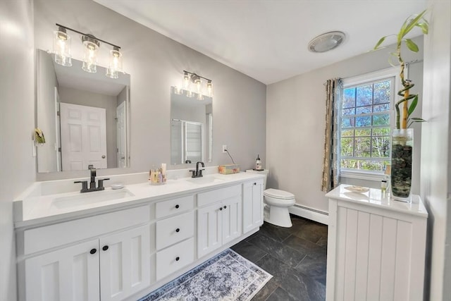 28 Sewall St, Shrewsbury, MA 01545 - bathroom with a baseboard radiator, a shower stall, double vanity, and toilet
