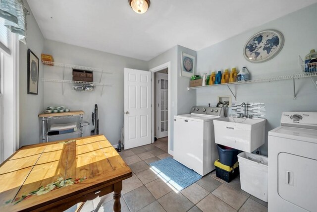 28 Sewall St, Shrewsbury, MA 01545 - laundry area featuring washing machine and dryer and light tile patterned floors