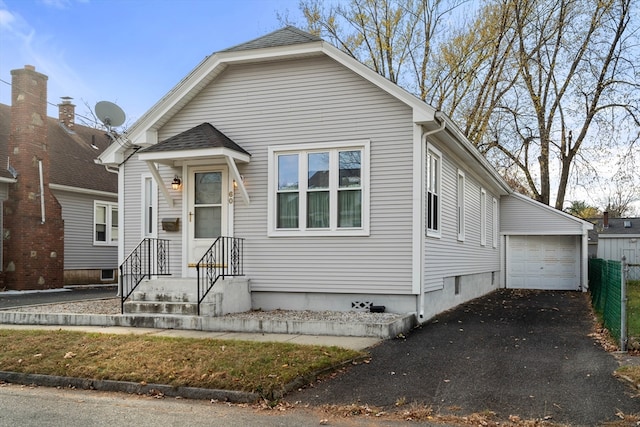 view of front of house featuring an outbuilding and a garage