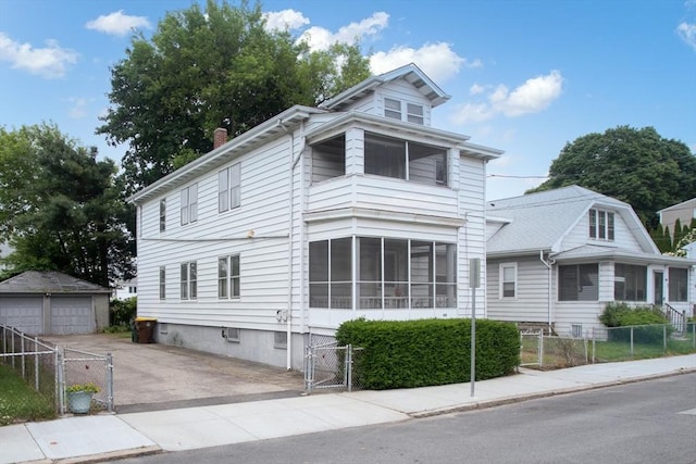 100 Weetamoe St, Fall River, MA 02720 - view of front of property with a gate, a detached garage, and a chimney
