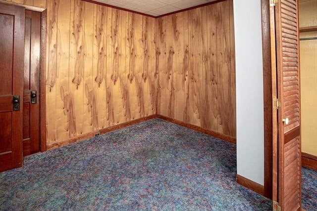100 Weetamoe St, Fall River, MA 02720 - carpeted spare room featuring wood walls and baseboards