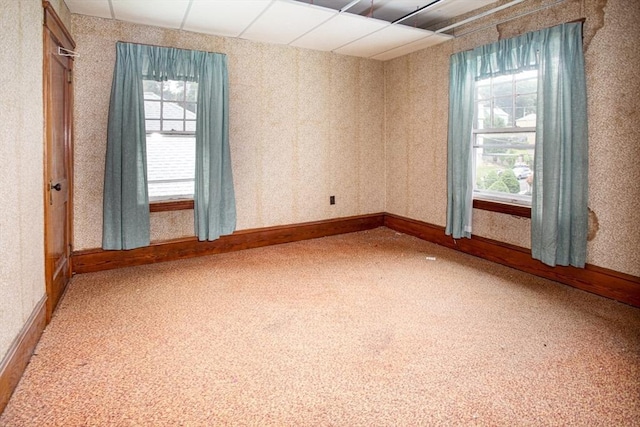 100 Weetamoe St, Fall River, MA 02720 - empty room with healthy amount of natural light and wallpapered walls