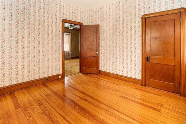 100 Weetamoe St, Fall River, MA 02720 - spare room with light wood-style flooring, a ceiling fan, and wallpapered walls