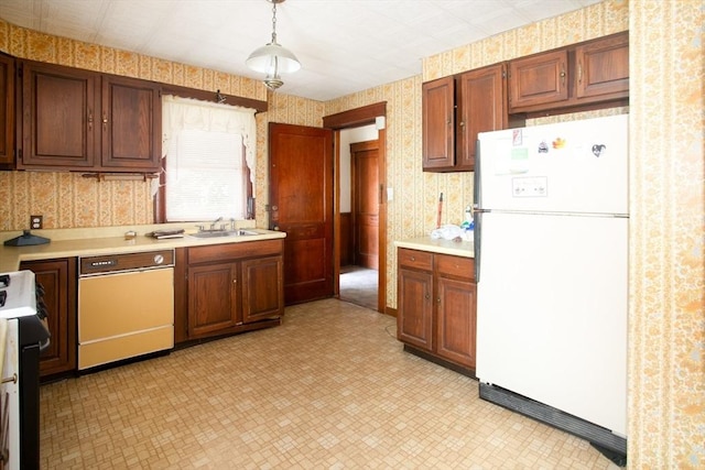 100 Weetamoe St, Fall River, MA 02720 - kitchen featuring white appliances, wallpapered walls, light countertops, light floors, and decorative light fixtures