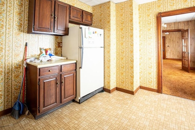 100 Weetamoe St, Fall River, MA 02720 - kitchen featuring freestanding refrigerator, wallpapered walls, light countertops, and light flooring