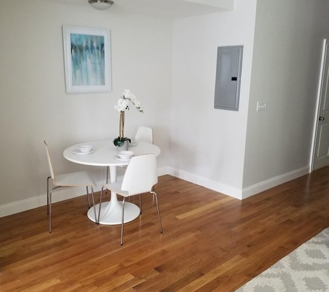 dining area with dark hardwood / wood-style flooring