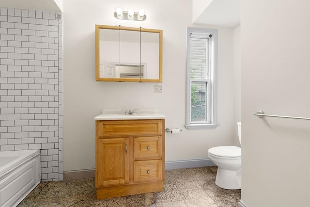bathroom with toilet, a bathtub, baseboards, walk in shower, and vanity