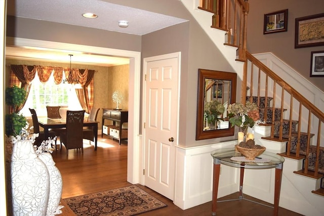 1820 Milk St, Dighton, MA 02715 - stairway featuring a chandelier and wood finished floors