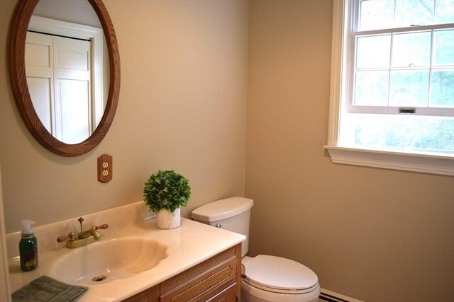 1820 Milk St, Dighton, MA 02715 - half bath with toilet, vanity, and a baseboard radiator