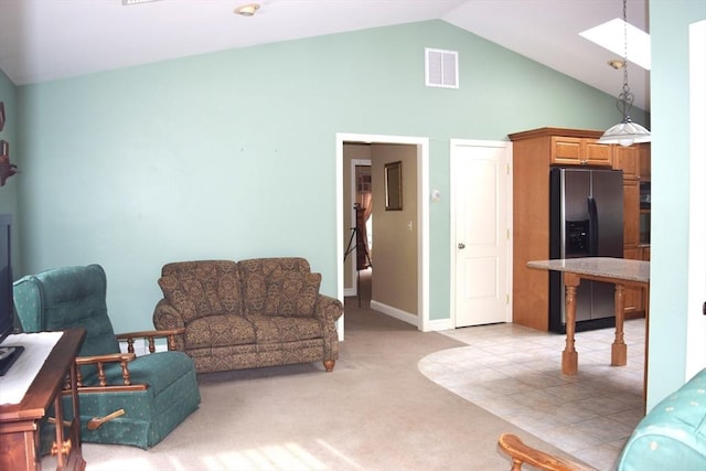 1820 Milk St, Dighton, MA 02715 - living area with light colored carpet, high vaulted ceiling, a skylight, and baseboards