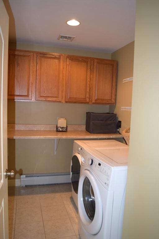 1820 Milk St, Dighton, MA 02715 - laundry area with baseboard heating, cabinet space, washer and dryer, light tile patterned flooring, and recessed lighting