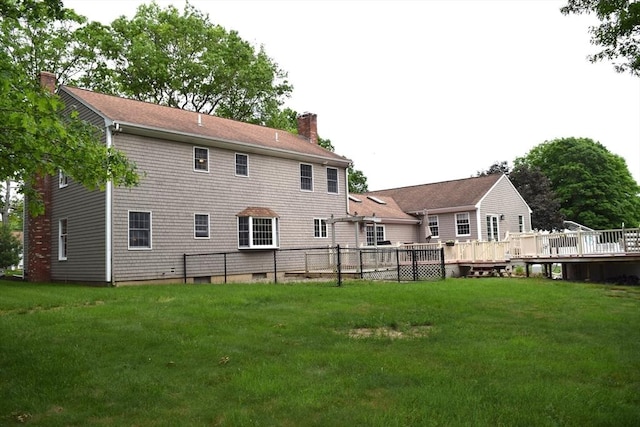 1820 Milk St, Dighton, MA 02715 - rear view of property featuring a chimney, a lawn, and a deck