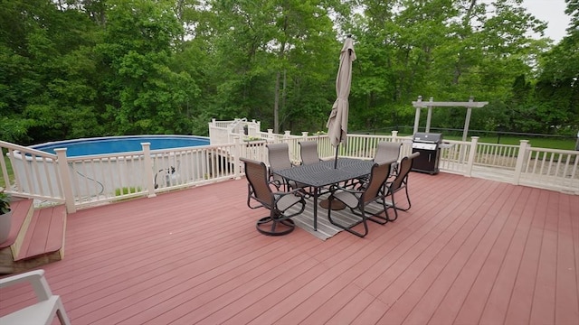 1820 Milk St, Dighton, MA 02715 - wooden terrace featuring outdoor dining space, an outdoor pool, area for grilling, and view of wooded area