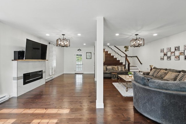 399 N Main St, Salem, NH 03079 - living area with a chandelier, a baseboard radiator, a glass covered fireplace, dark wood-type flooring, and recessed lighting