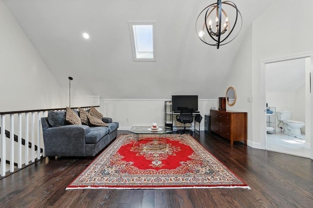 399 N Main St, Salem, NH 03079 - living room featuring lofted ceiling, a chandelier, wood finished floors, a skylight, and baseboards