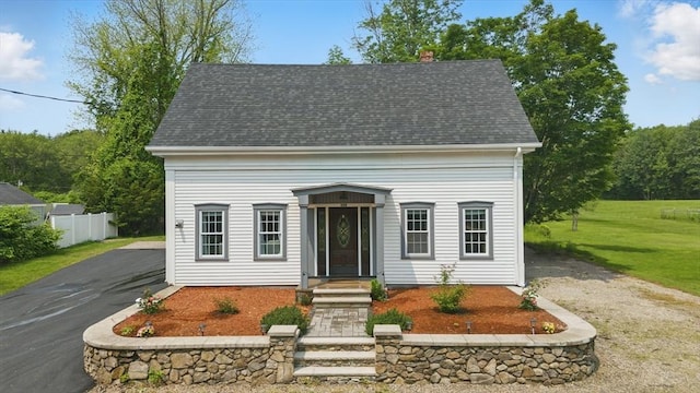 399 N Main St, Salem, NH 03079 - cape cod house featuring asphalt driveway, a shingled roof, and a chimney