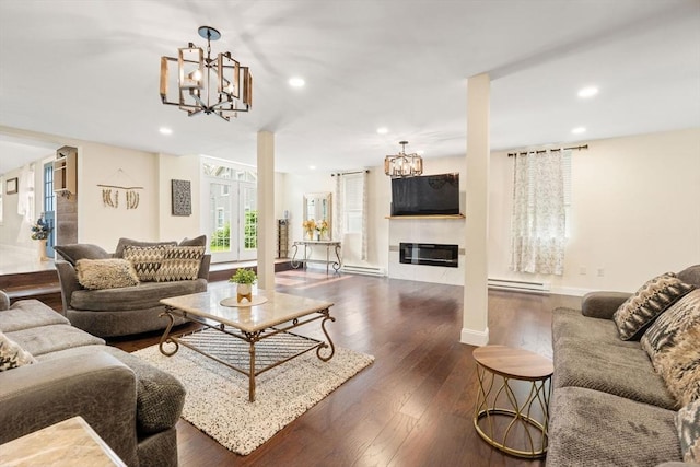 399 N Main St, Salem, NH 03079 - living area with a chandelier, a baseboard radiator, recessed lighting, wood finished floors, and baseboards