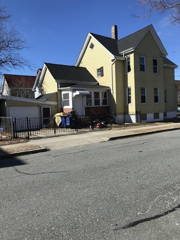 exterior space featuring a fenced front yard and a chimney