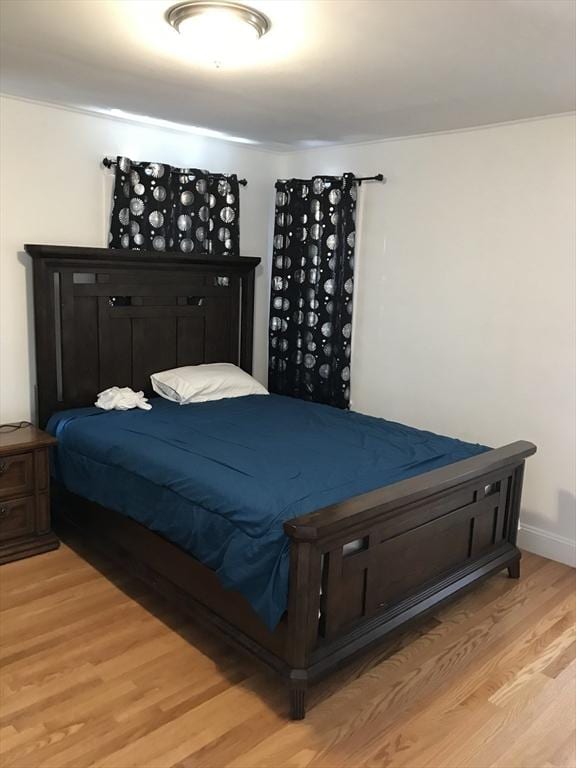 bedroom featuring light wood-style floors