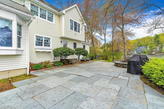 view of patio featuring a grill