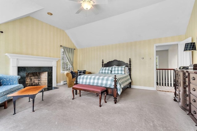 bedroom featuring wallpapered walls, lofted ceiling, baseboards, carpet floors, and a baseboard heating unit