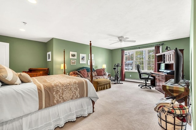 bedroom featuring a desk, baseboard heating, carpet floors, ceiling fan, and baseboards