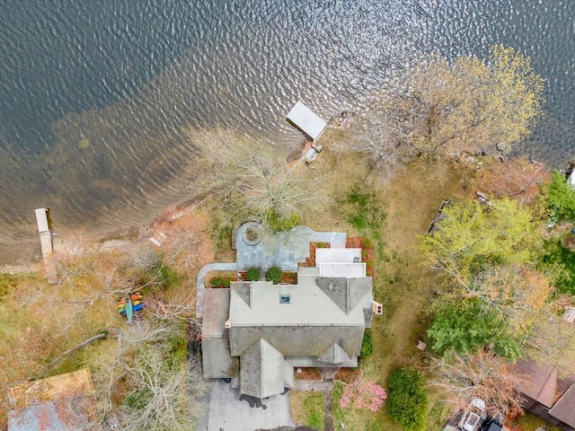 aerial view of property and surrounding area featuring a nearby body of water