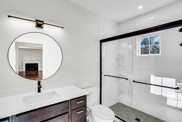 bathroom featuring tile patterned floors, vanity, toilet, and walk in shower