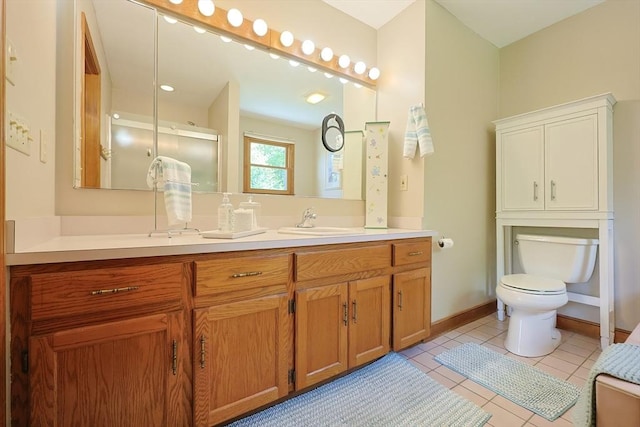 15 Amys Way, Franklin, MA 02038 - full bathroom featuring double vanity, toilet, tile patterned floors, a shower with door, and baseboards