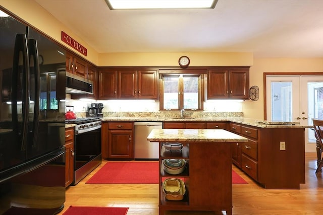 15 Amys Way, Franklin, MA 02038 - kitchen featuring appliances with stainless steel finishes, a peninsula, light wood finished floors, and open shelves