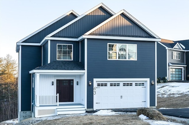 view of front facade featuring a porch, a shingled roof, board and batten siding, and a garage