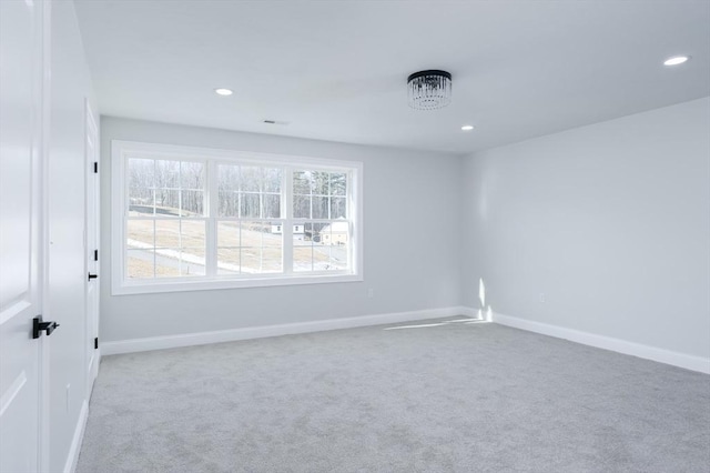 carpeted empty room with recessed lighting, a wealth of natural light, and baseboards