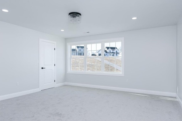 carpeted empty room with recessed lighting and baseboards