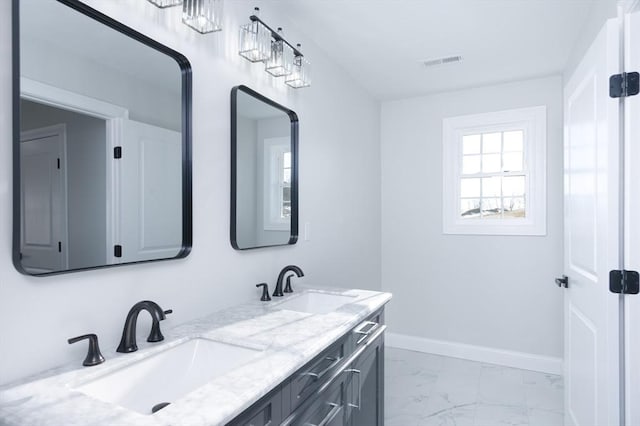 full bath featuring marble finish floor, visible vents, a sink, and baseboards