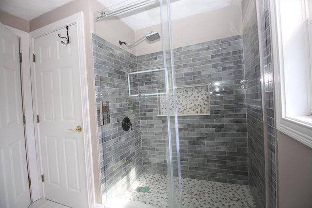 bathroom featuring a stall shower