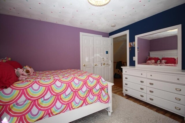 bedroom with dark wood-style floors