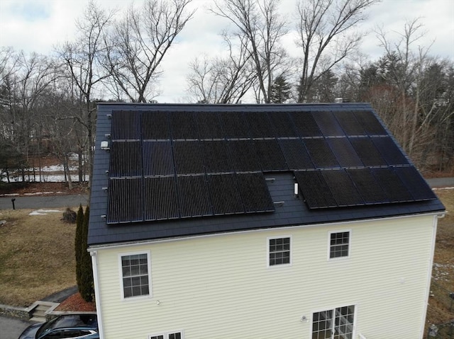 rear view of house with solar panels