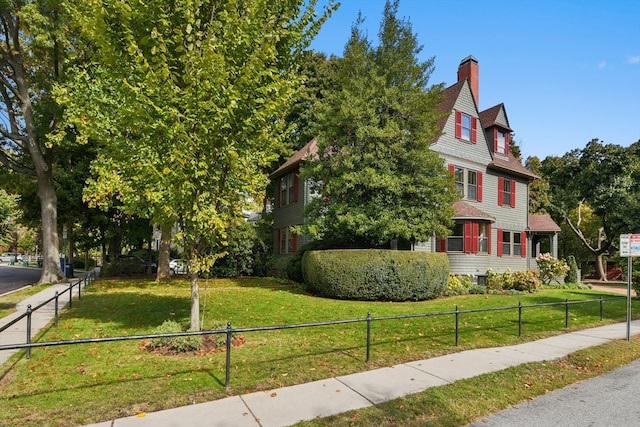 view of property exterior featuring a lawn