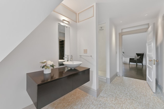 bathroom with vanity and hardwood / wood-style flooring