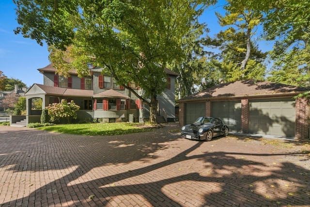 view of front of property featuring a garage and a porch