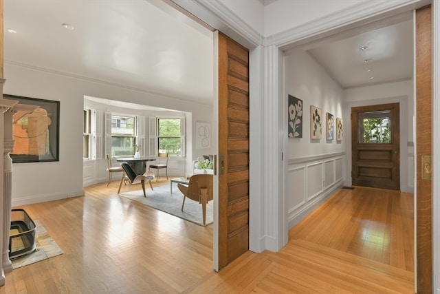 foyer entrance with light hardwood / wood-style floors