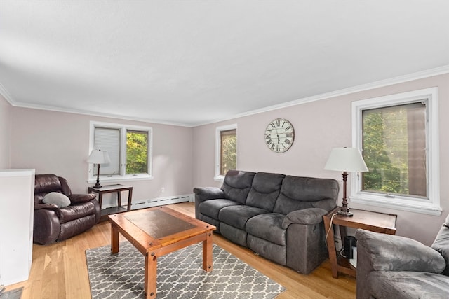 living room with a healthy amount of sunlight, light hardwood / wood-style floors, and a baseboard heating unit