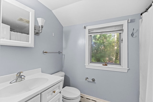 bathroom featuring vaulted ceiling, vanity, and toilet