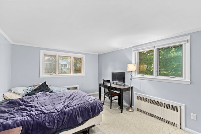 carpeted bedroom with crown molding and radiator heating unit